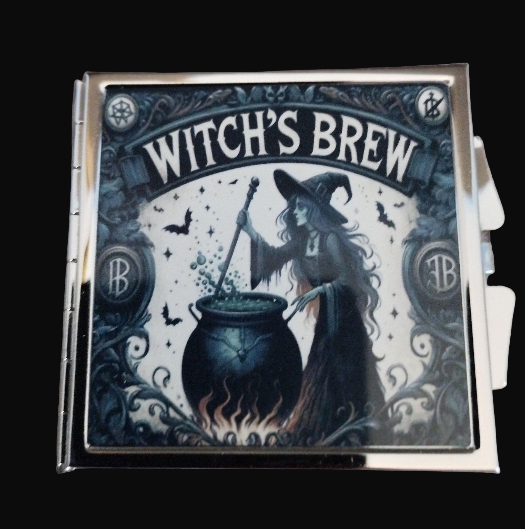 Witches Brew product packaging with a witch stirring a pot on a wooden surface