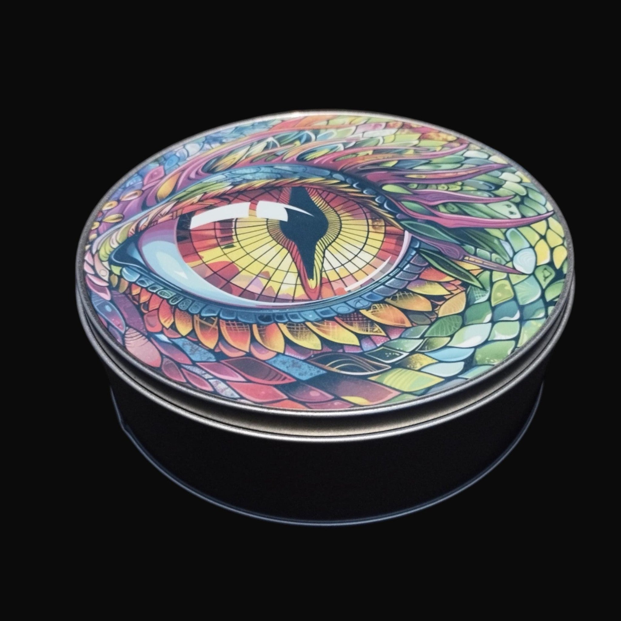 Colorful dragon eye design on a round container against a black background