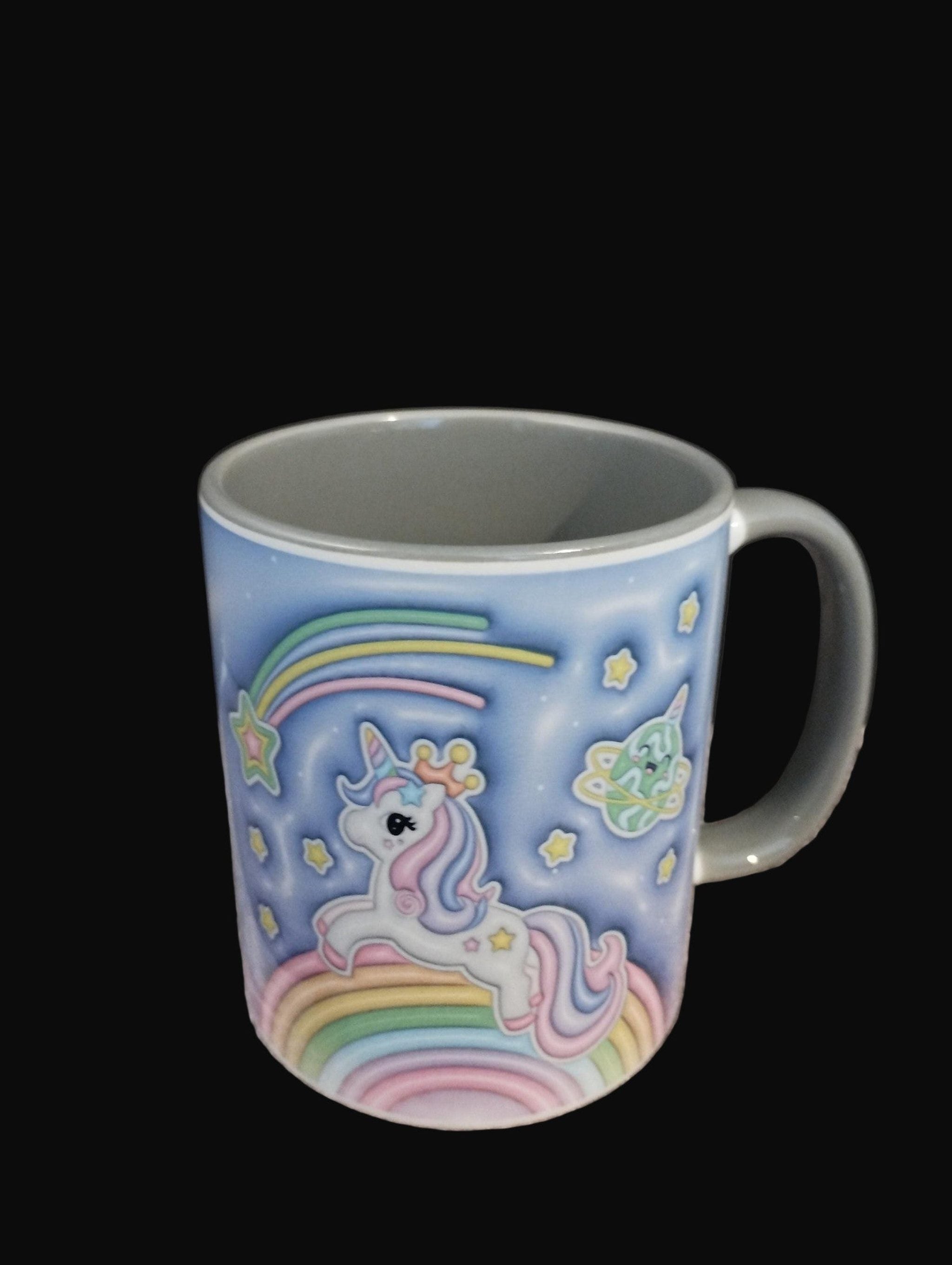 Mug with a unicorn and rainbow design on a black background