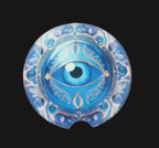 Decorative blue eye design on a wooden surface