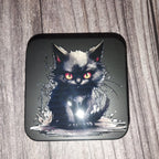tin with a black cat design on a wooden surface