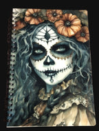 Notebook cover with a design of a woman with a skull makeup and flowers