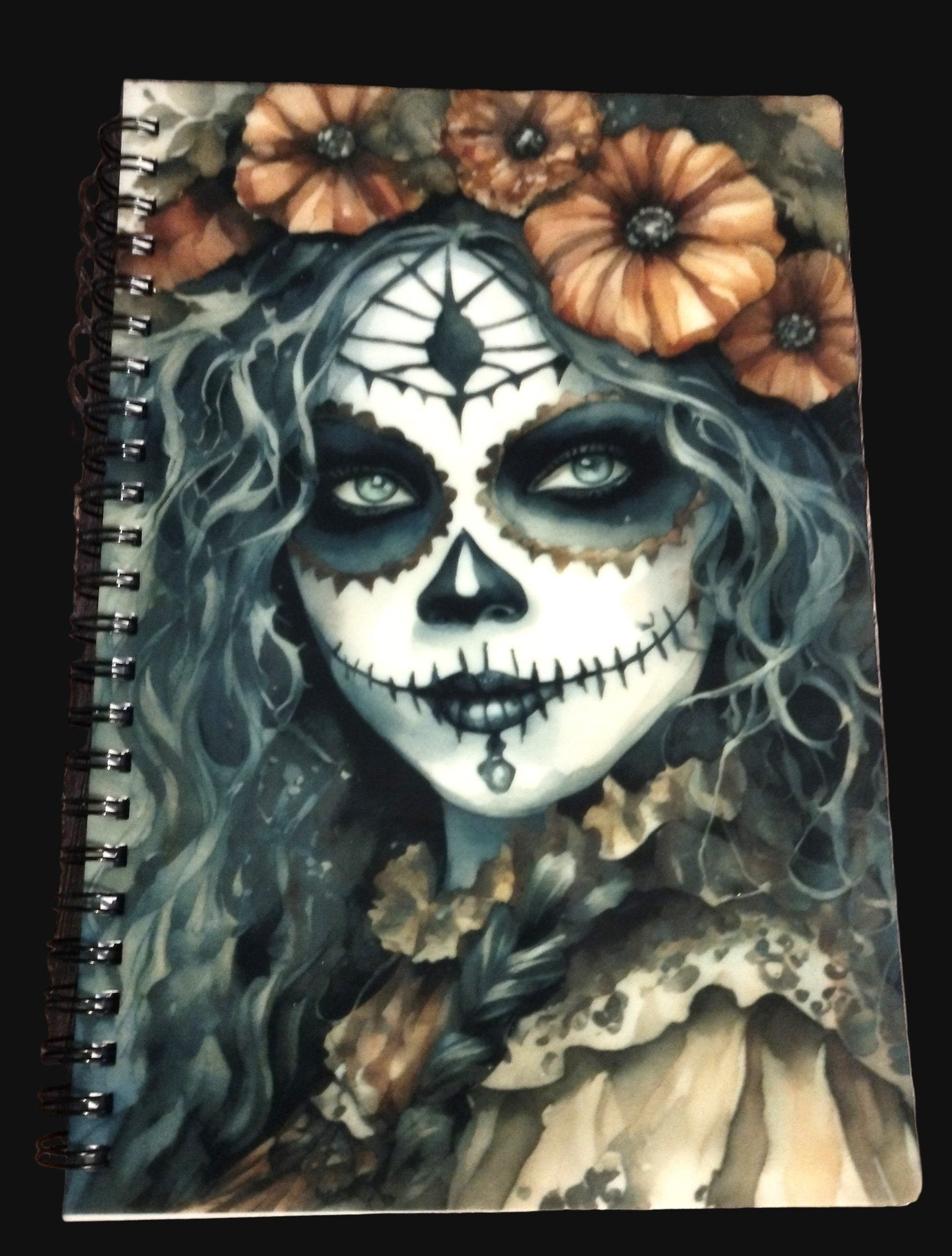 Notebook cover with a design of a woman with a skull makeup and flowers