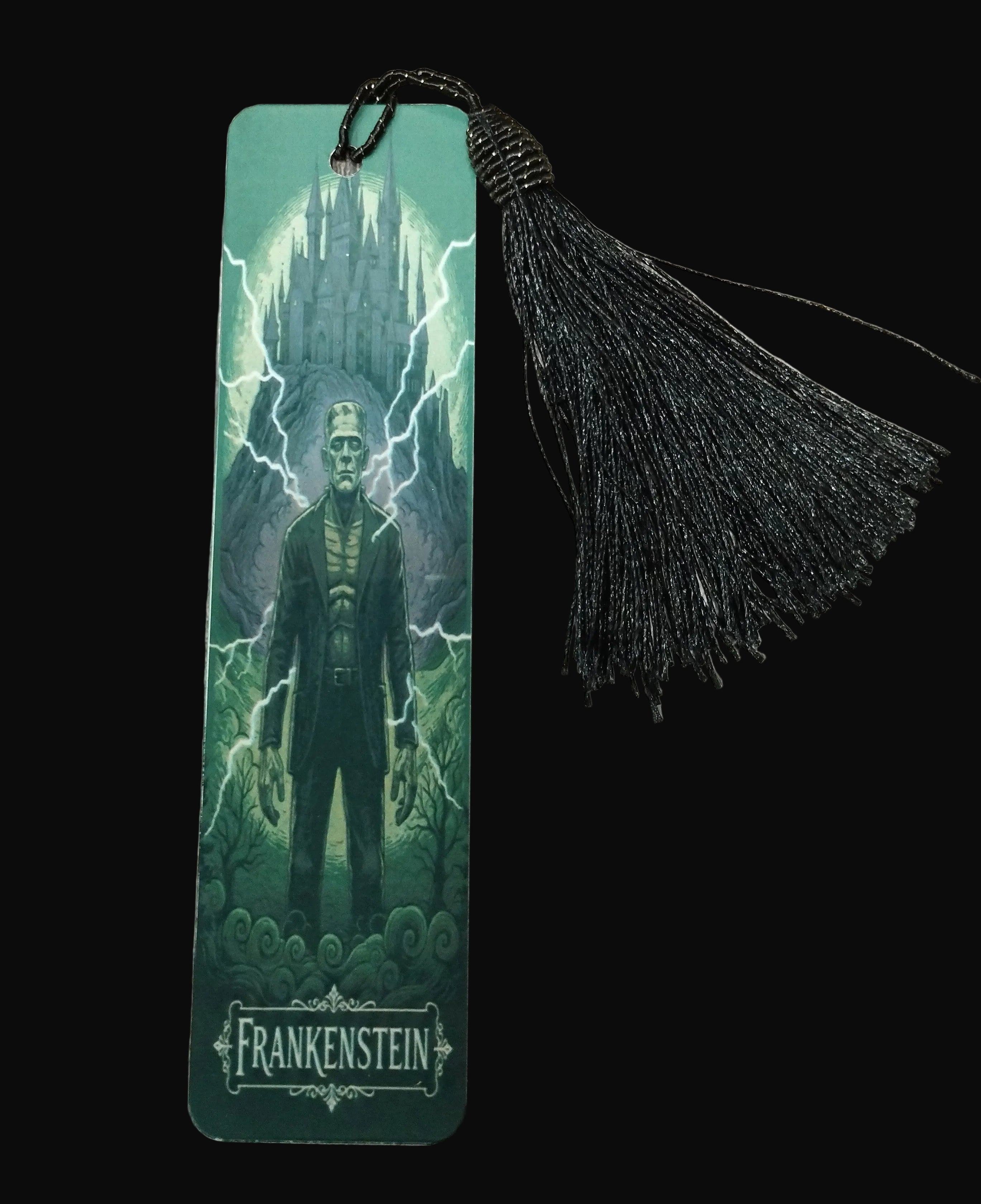 Bookmark with Frankenstein design and black tassel on a wooden surface