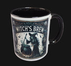 Mug with witch-themed design and 'Witch's Brew' text on a wooden surface.