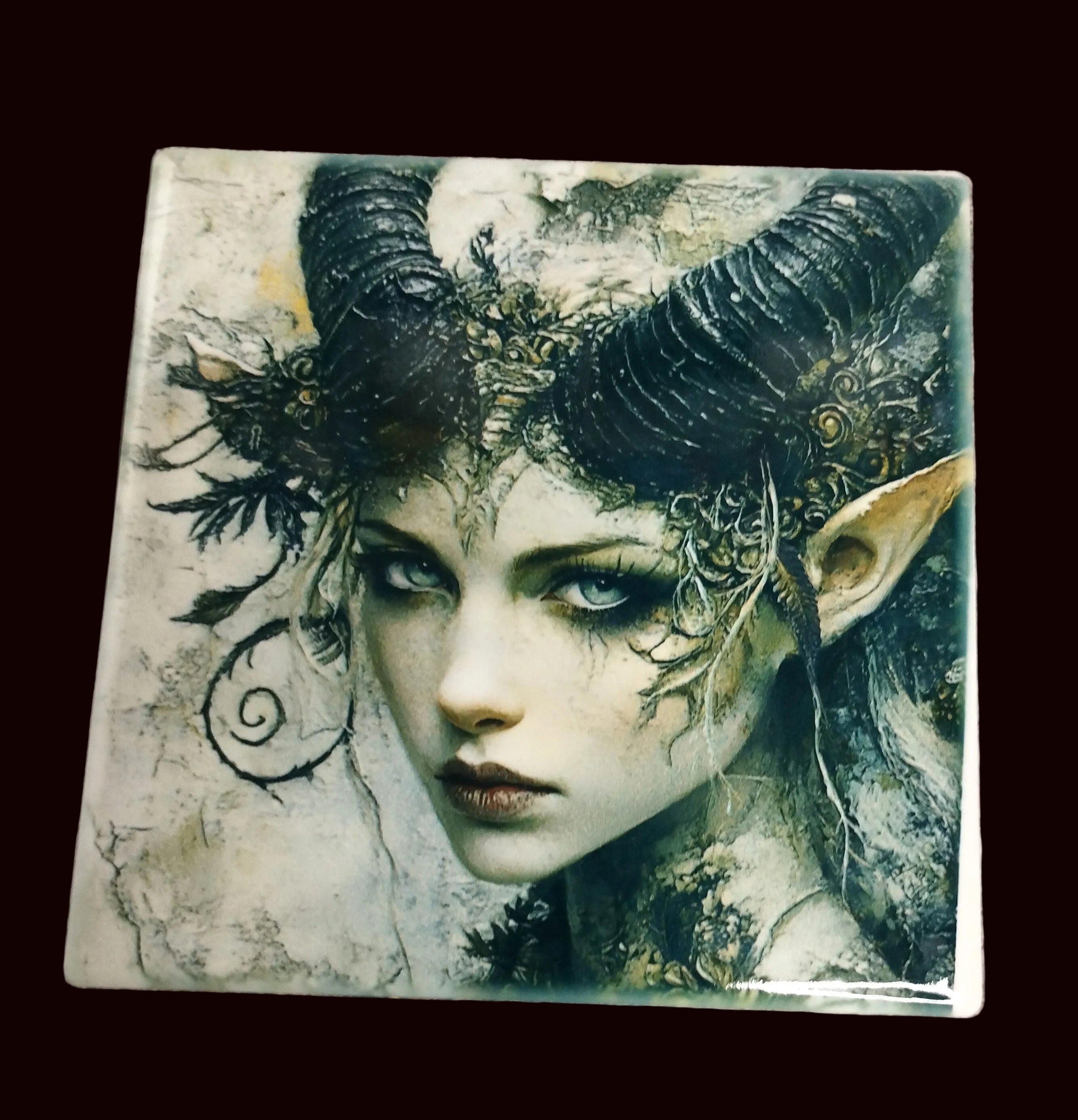 ceramic coaster with dark fae design