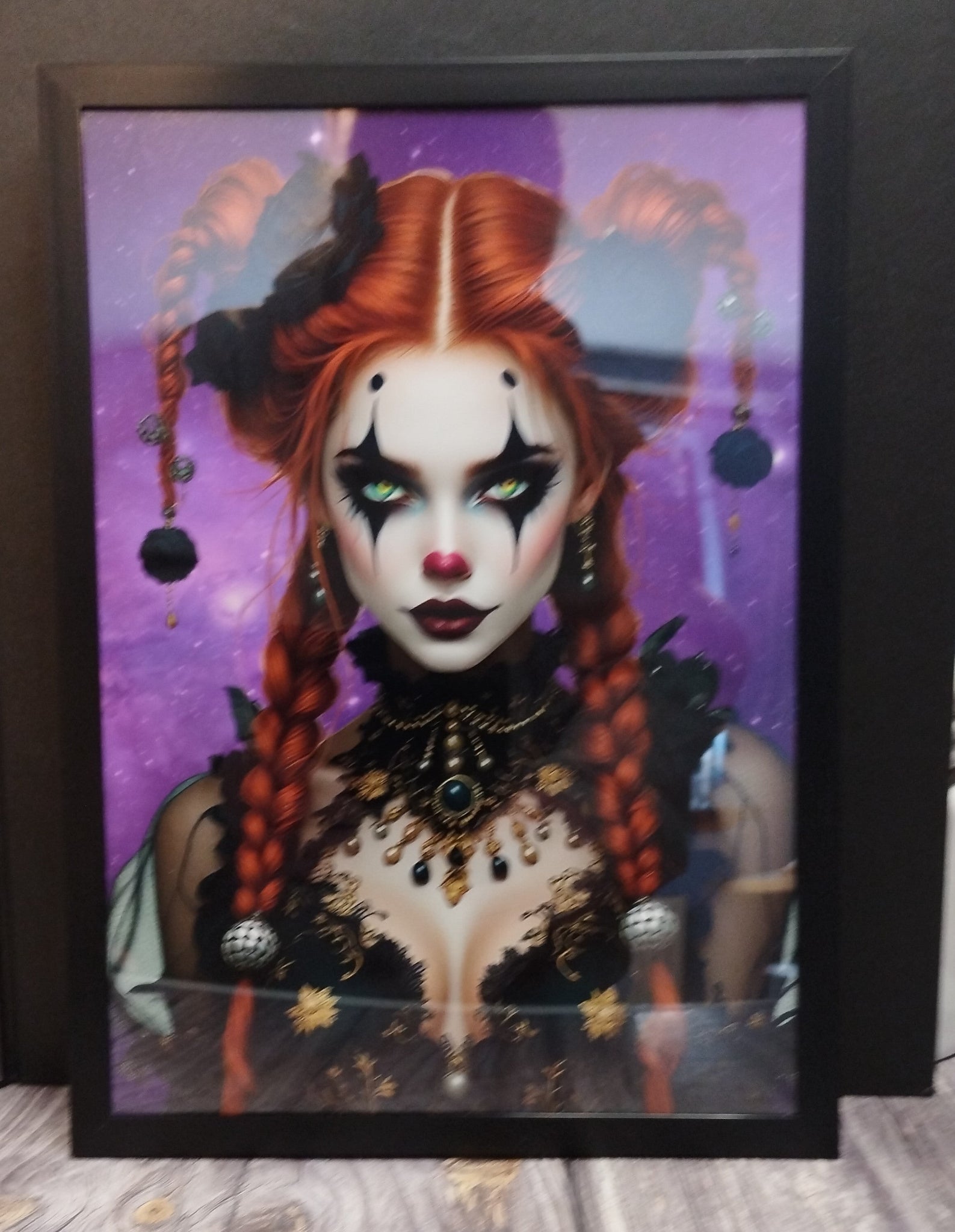 Framed artwork of a person with red hair styled in pigtails, wearing makeup and decorative clothing on a purple background.