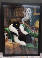 Framed artwork of a black cat in a luxurious setting with books and a smoking cigarette.