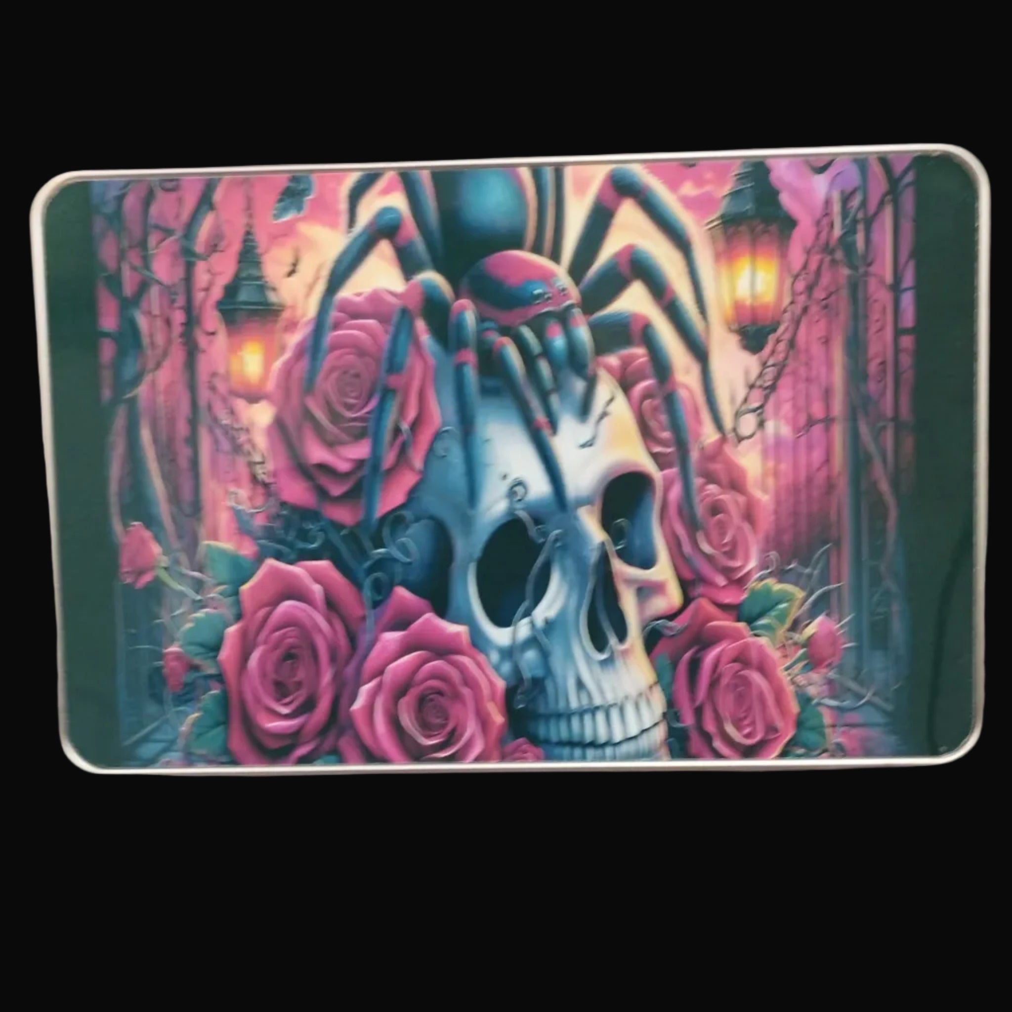 Decorative tin with a skull and roses design on a wooden surface