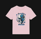 Pink t-shirt with a skull and floral design on a white background