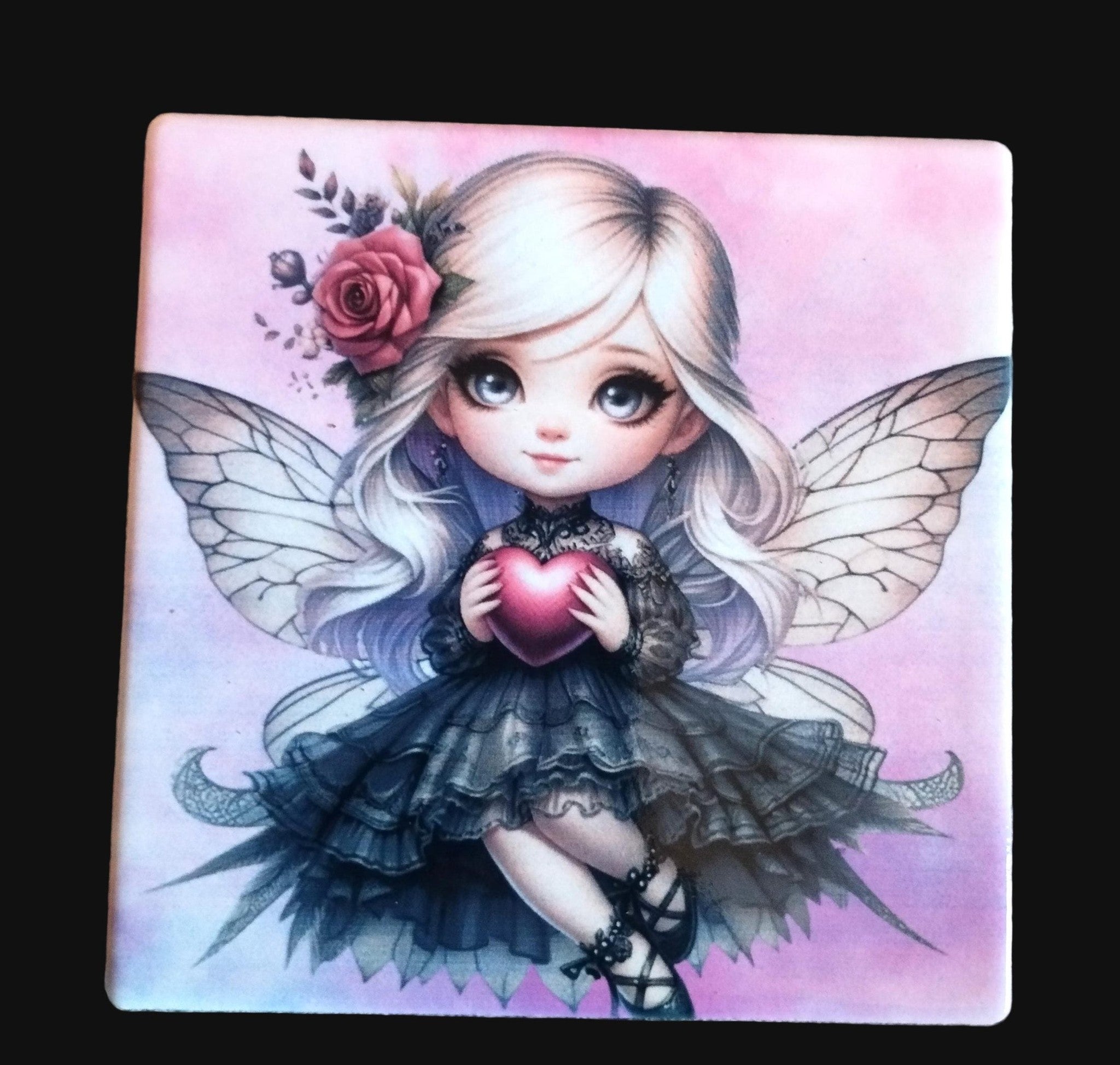 Fairy holding a heart with floral decorations on a pink background