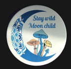 Circular sign with mushrooms and 'Stay wild Moon child' text on a purple background