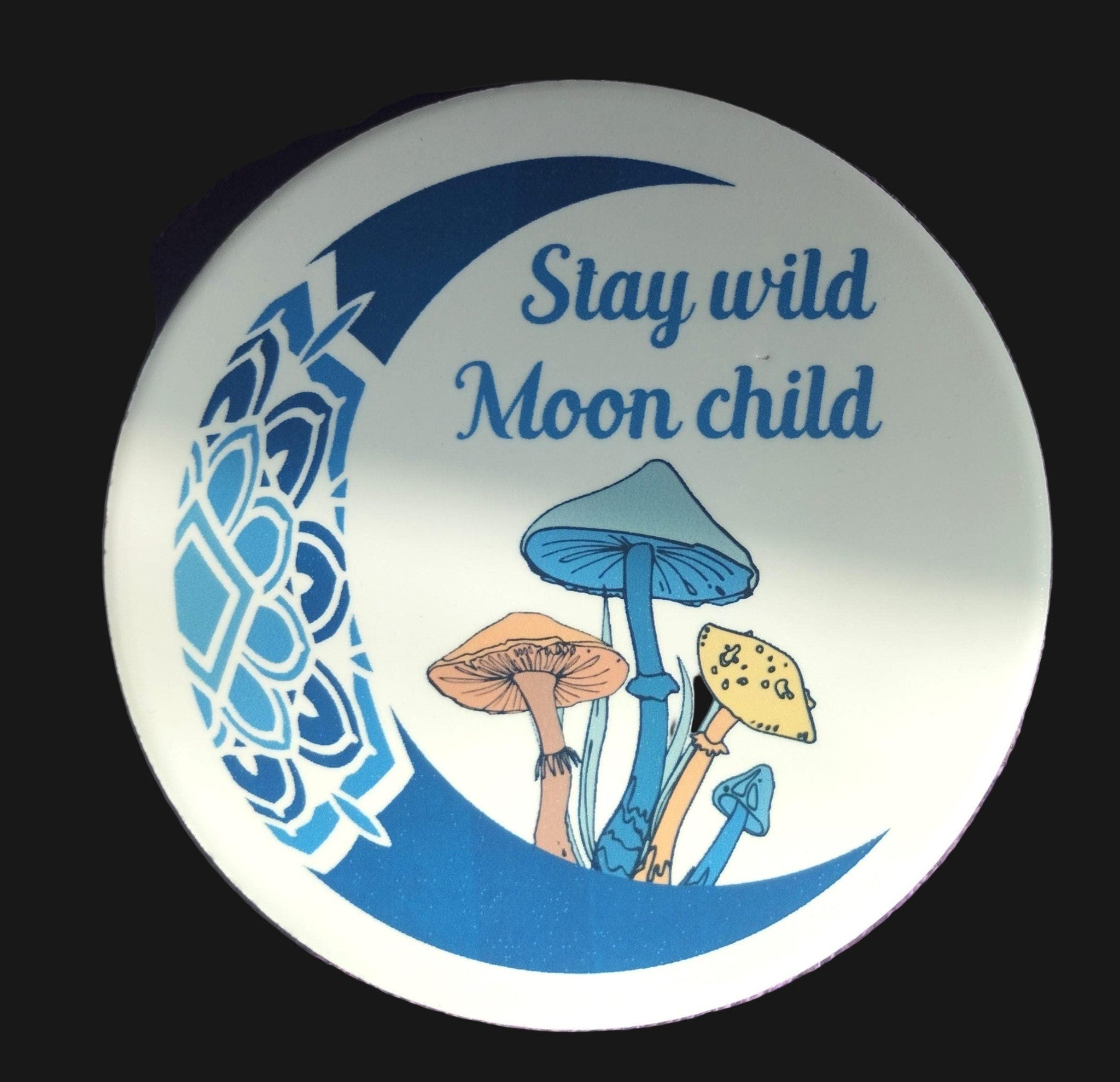Circular sign with mushrooms and 'Stay wild Moon child' text on a purple background
