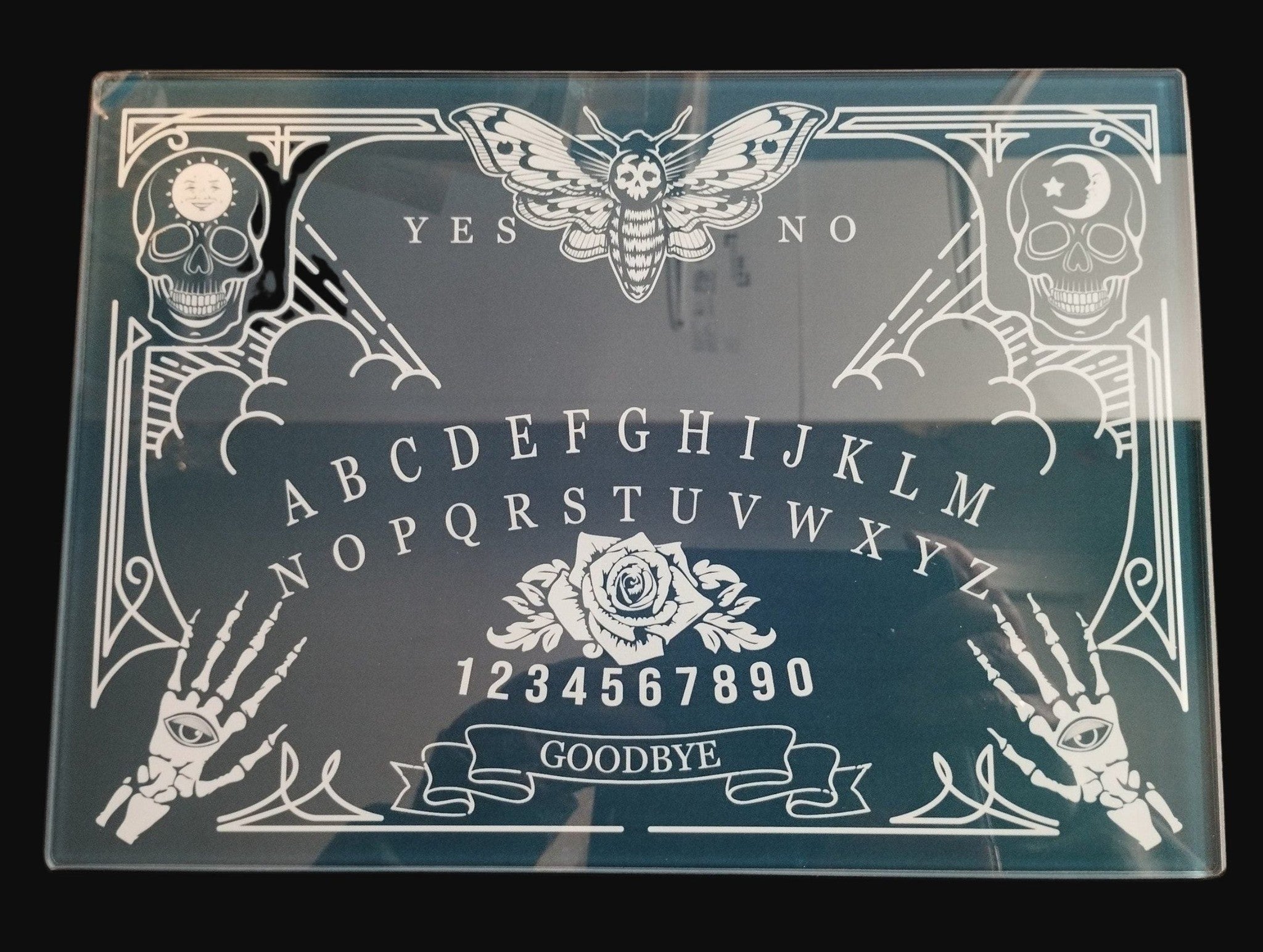 Ouija board  Table Mat with decorative elements on a dark background