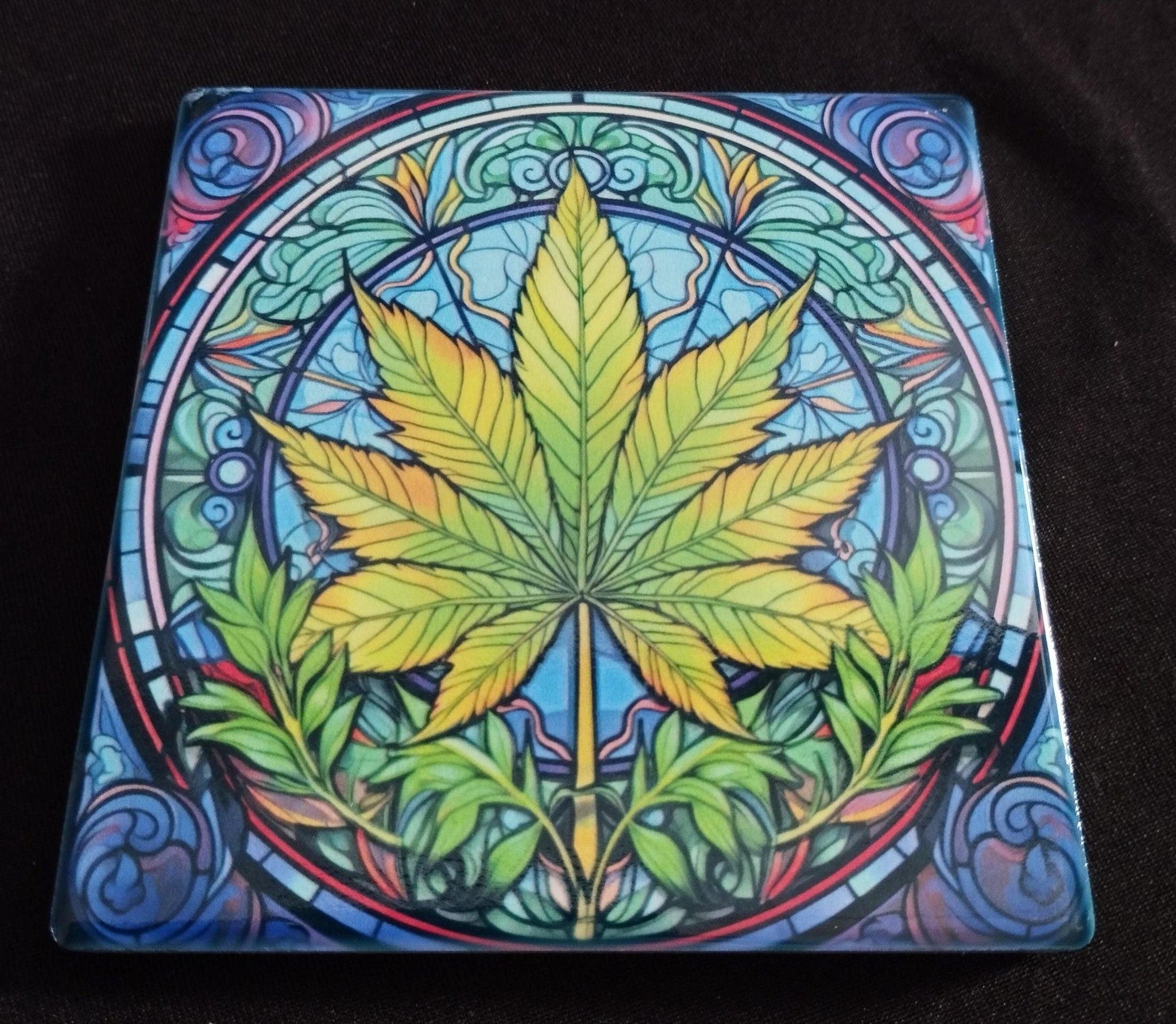 Colorful cannabis leaf design on a black background