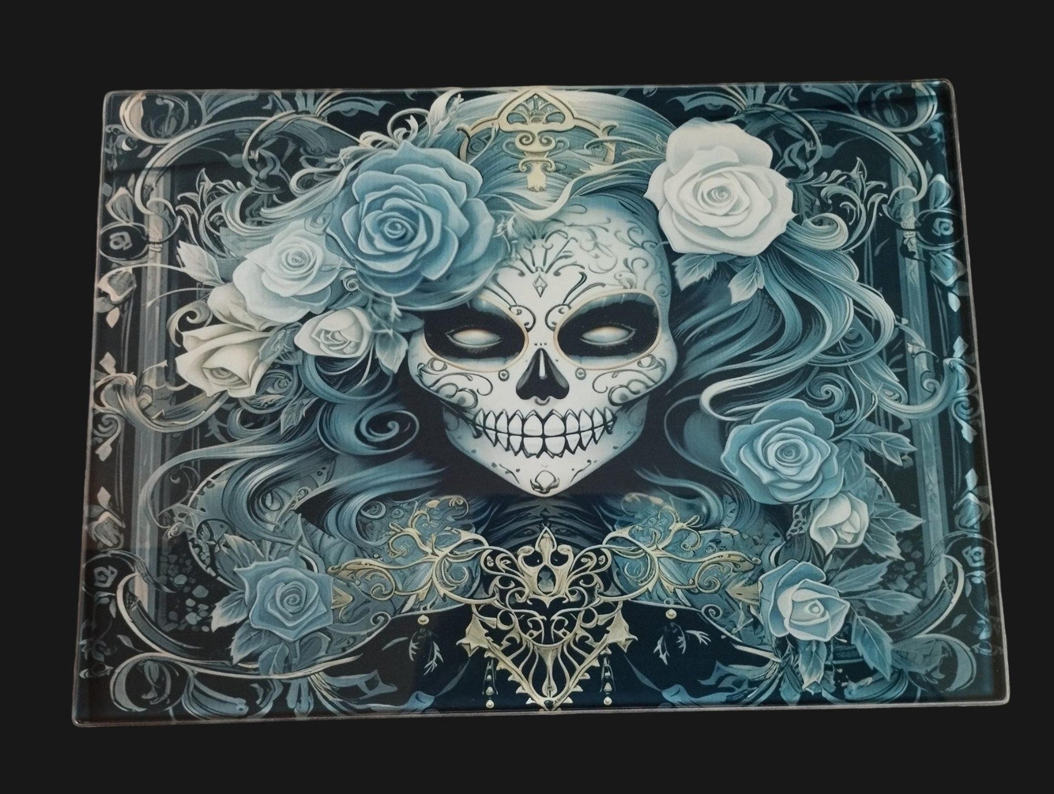 Decorative skull with floral design on a dark background