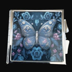 Decorative card with a blue butterfly and floral design on a wooden surface