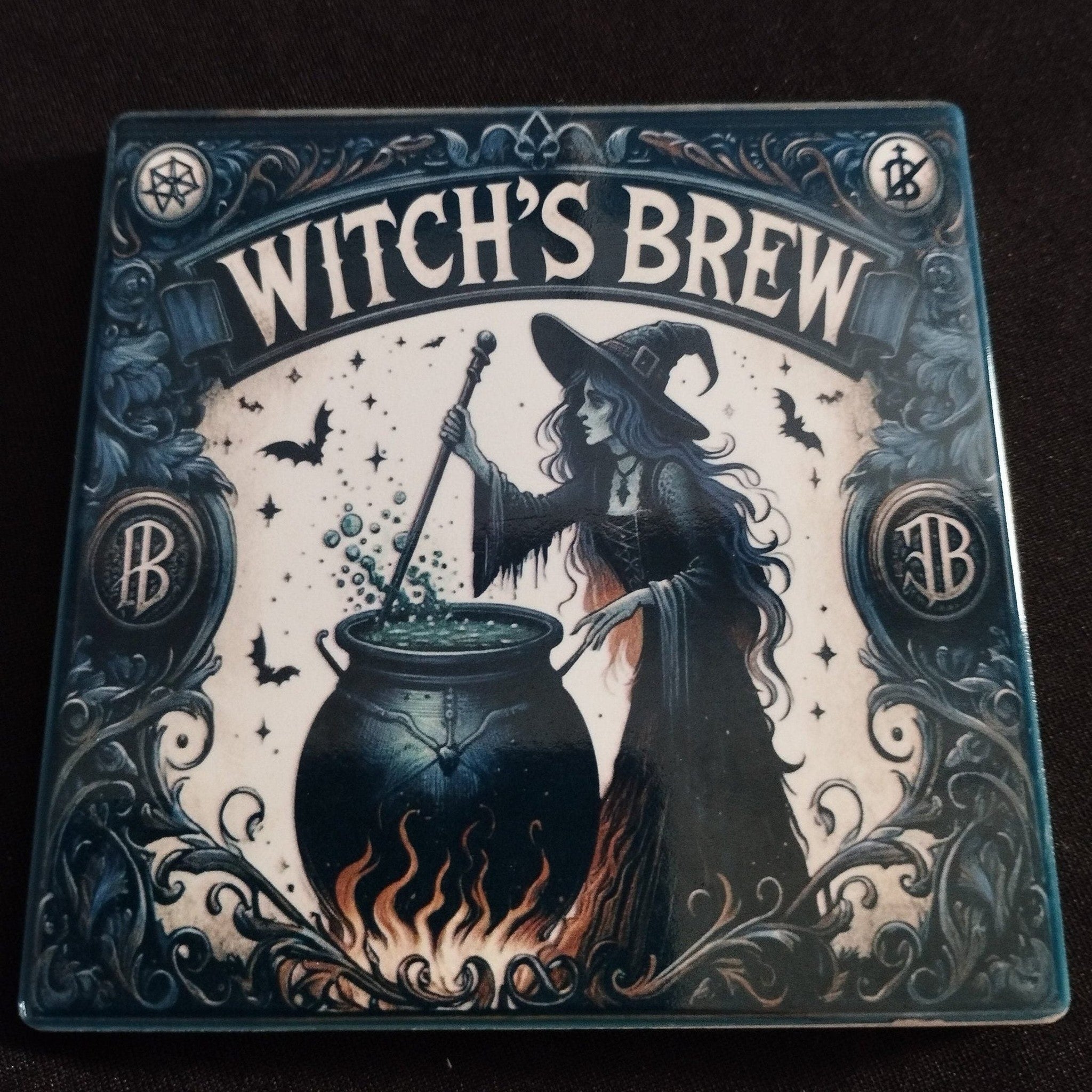 Decorative box labeled 'Witch's Brew' with a witch stirring a pot on a black background