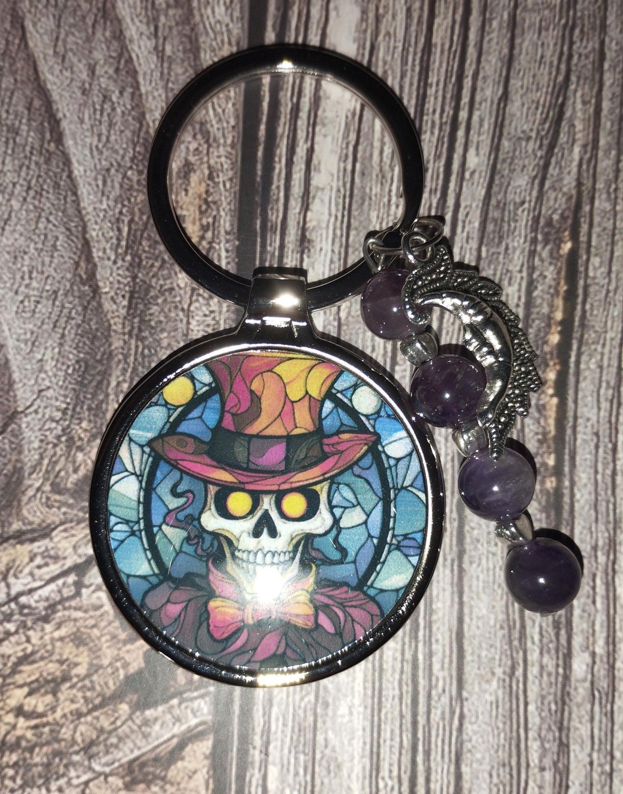 Skeleton keyring with amethyst crystals and a charm