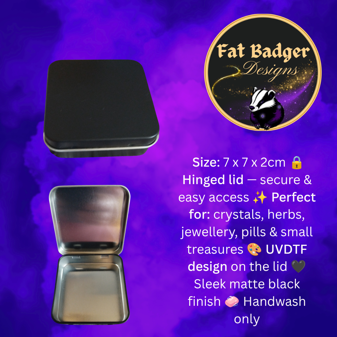 A pair of small square metal tins with hinged lids, shown closed and open against a purple background. The tins are matte black.
