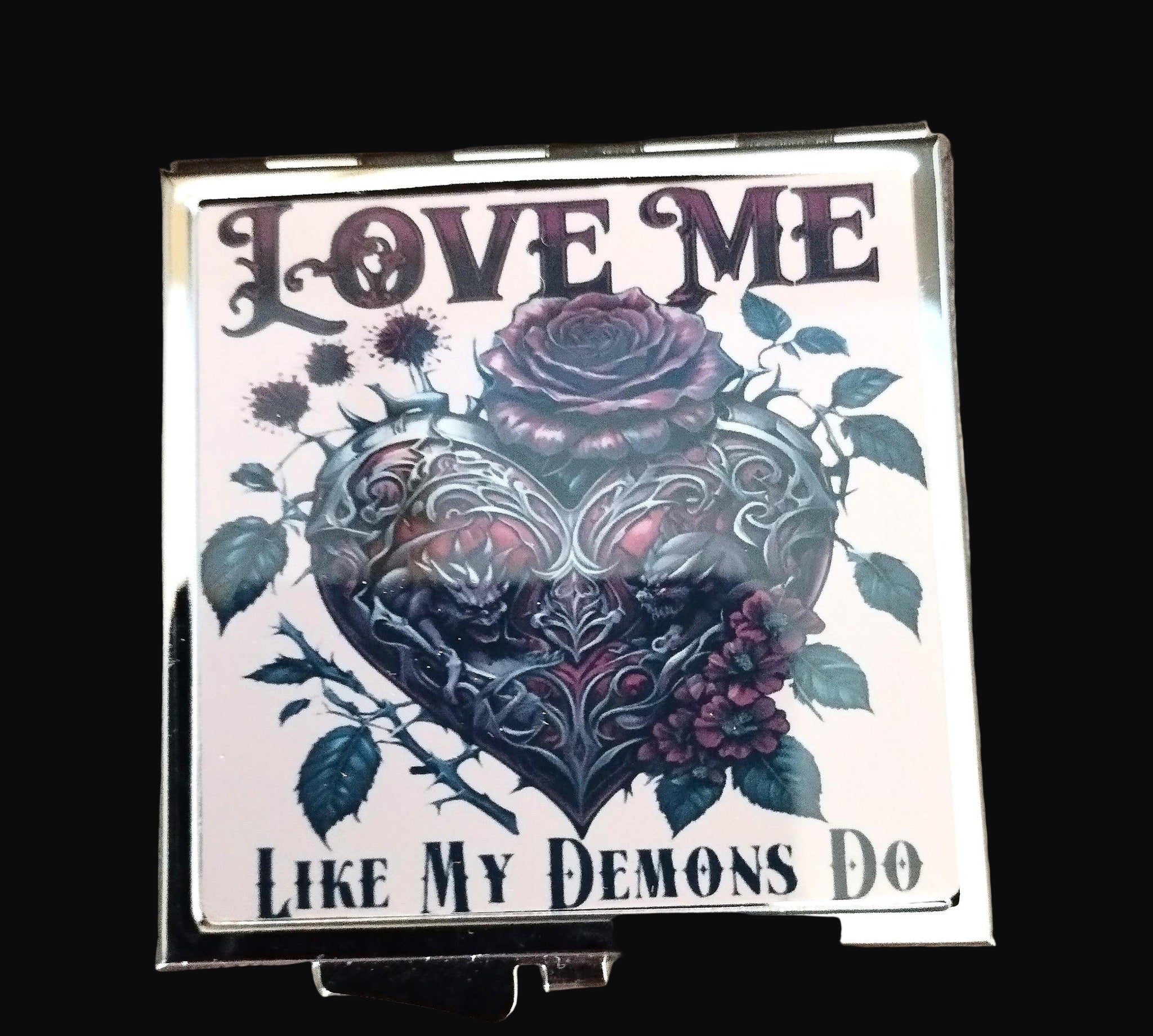 Decorative square with floral design and text on a wooden surface