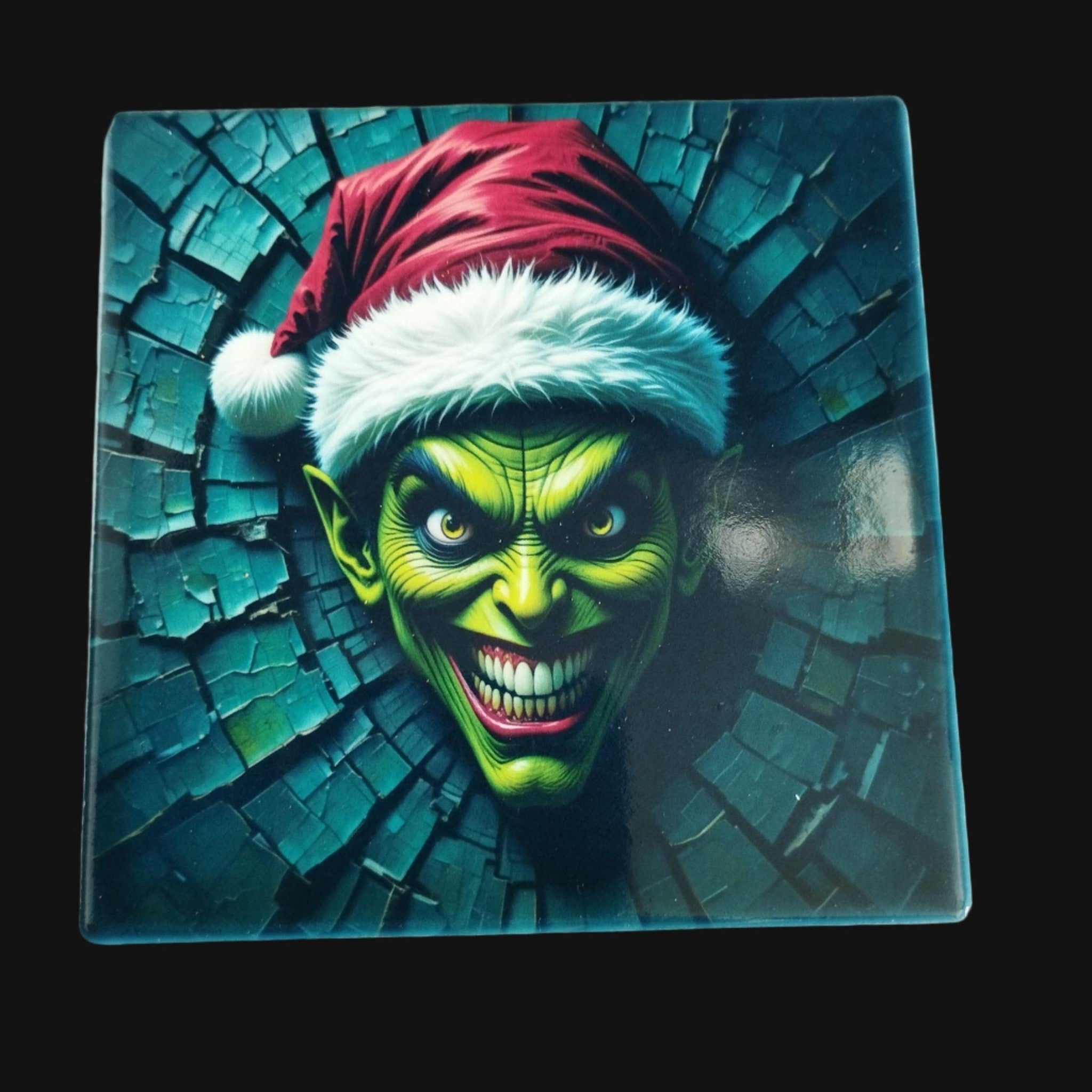 Green creature wearing a Santa hat on a textured blue background