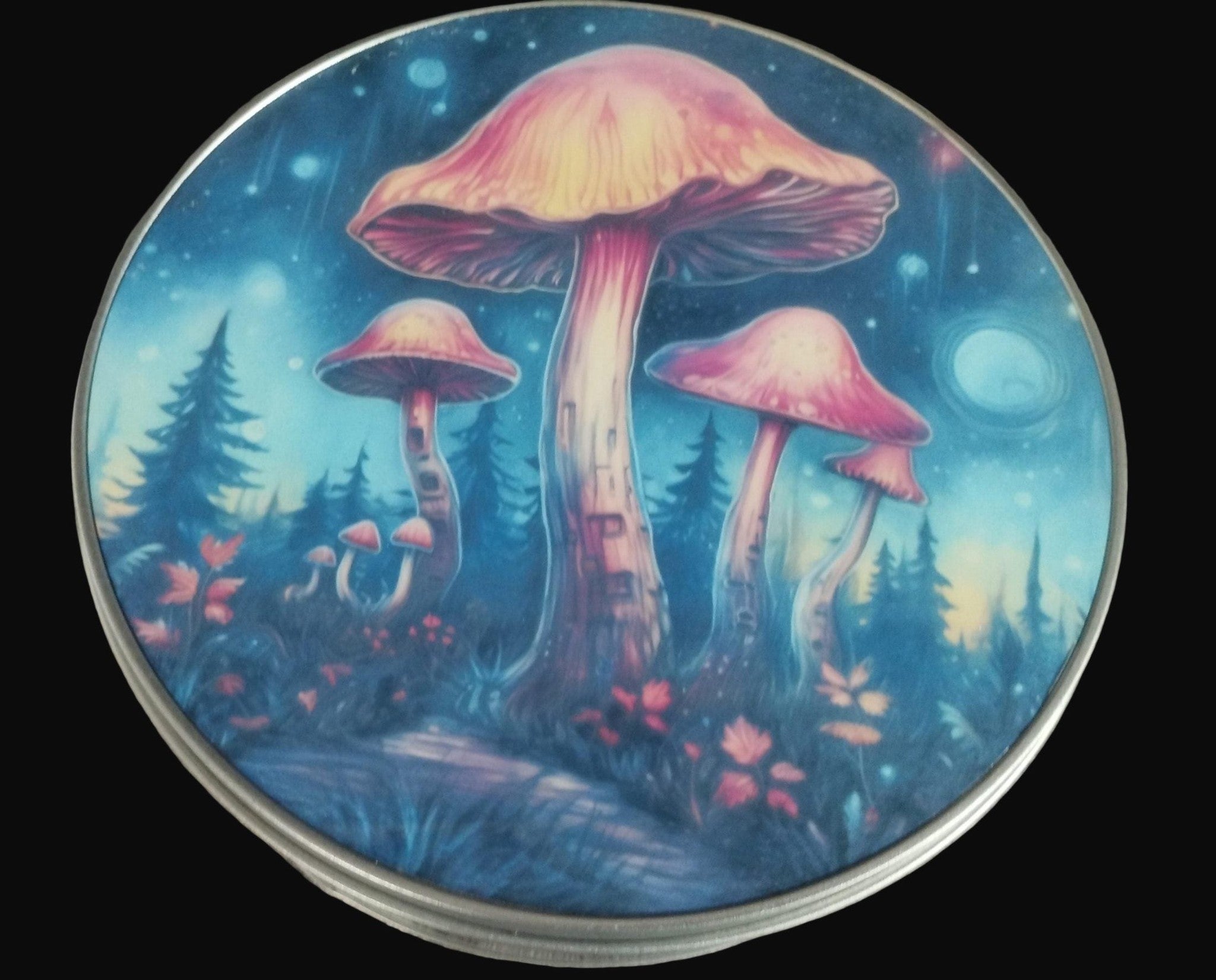 Round container lid with a colorful mushroom design on a wooden surface