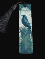 Decorative bookmark with a blue bird design on a wooden surface