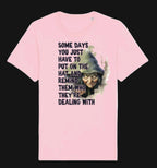 Pink t-shirt with graphic design and text on a white background
