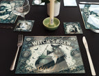 Table setting with 'Witch's Brew' themed placemats, glasses, and cutlery on a black surface.