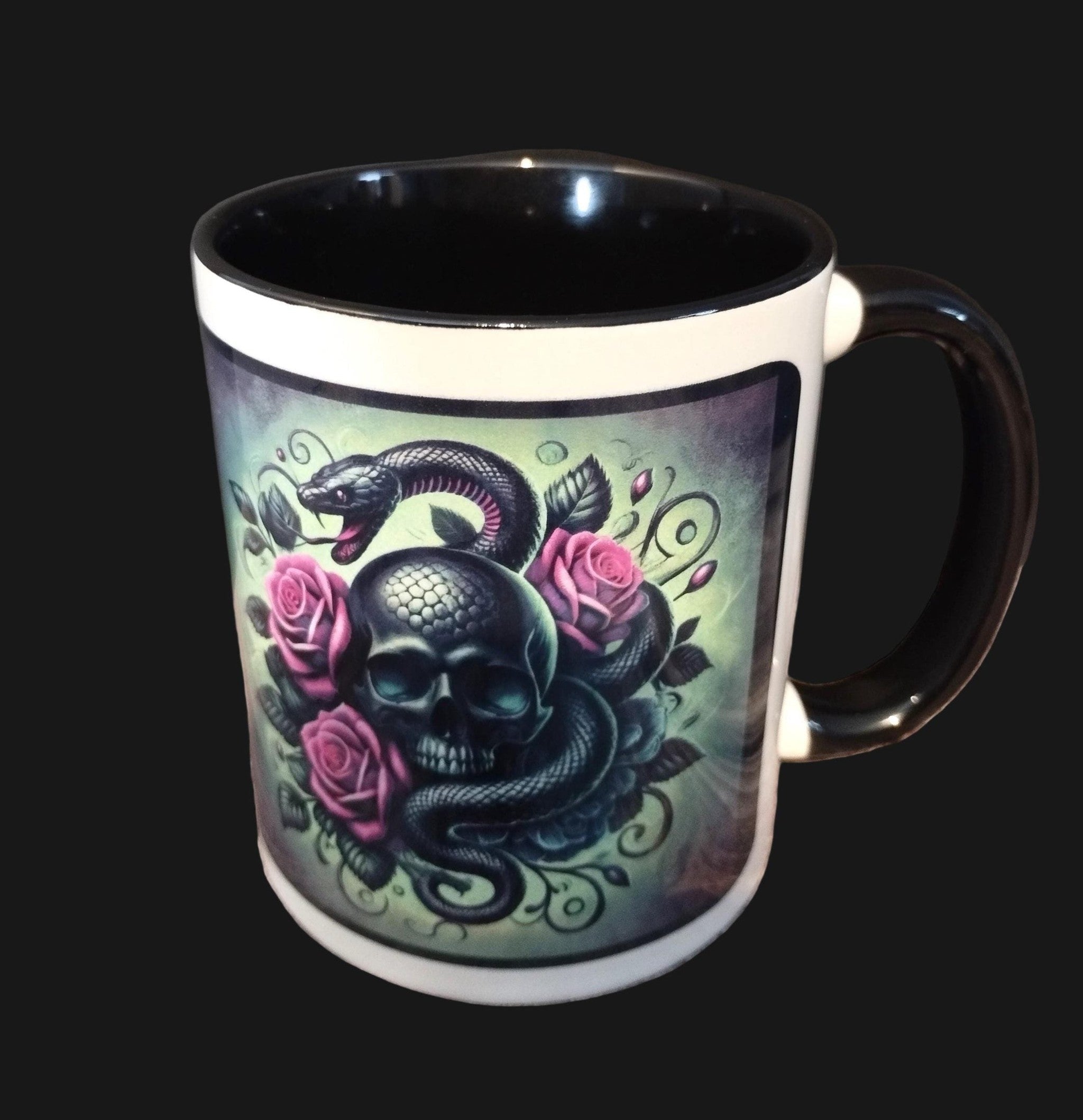 Mug with skull and snake design on a wooden surface
