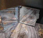 Foldable mirror with wooden texture on a wooden surface