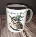 Mug with owl design and text 'Who's Ready for Magic?' on a wooden surface