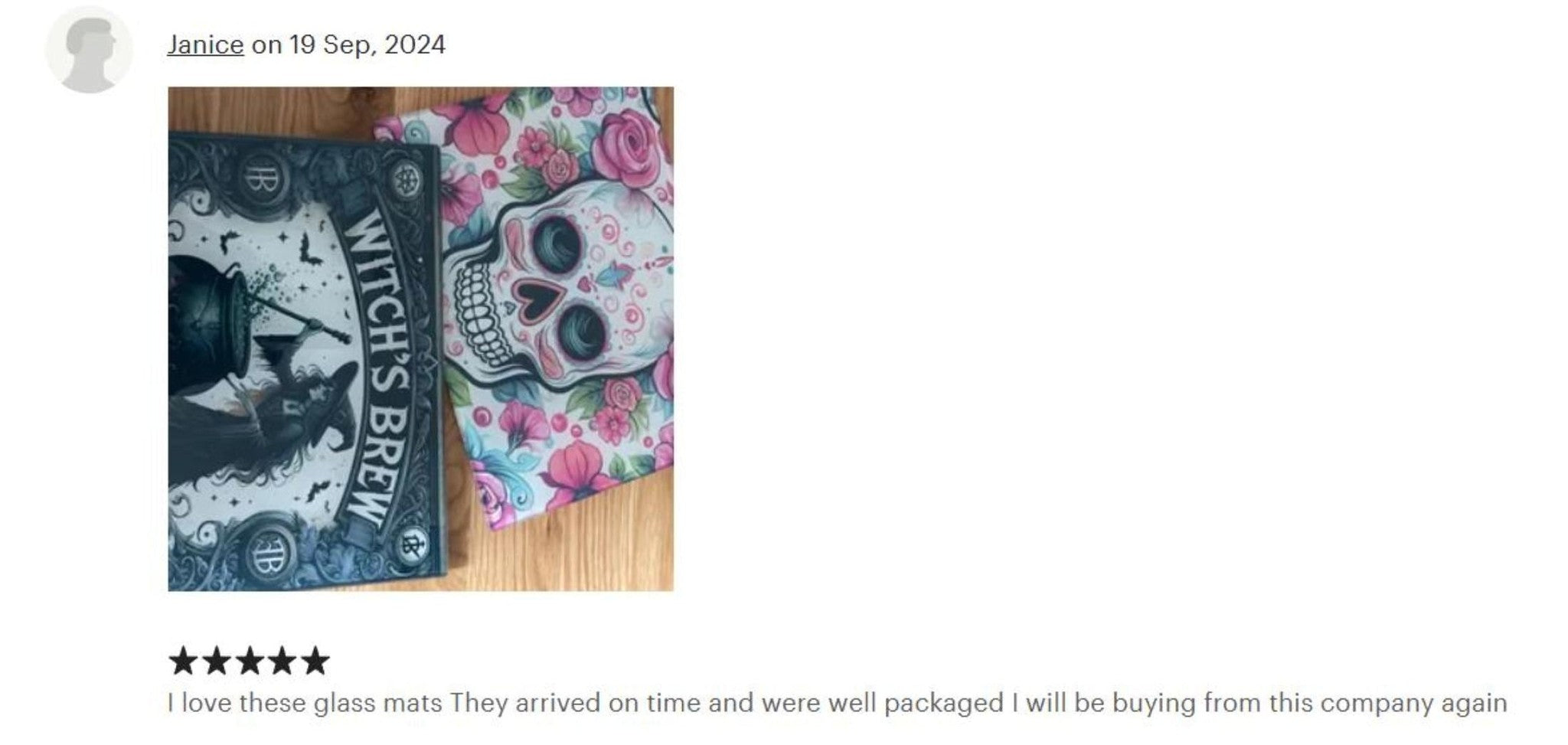 Two glaze mats with skull designs on a wooden surface, reviewed by Janice.