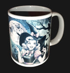 Mug with a witch design featuring a full moon and trees on a wooden surface.