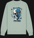 Light green sweatshirt with a skull and floral design on a white background