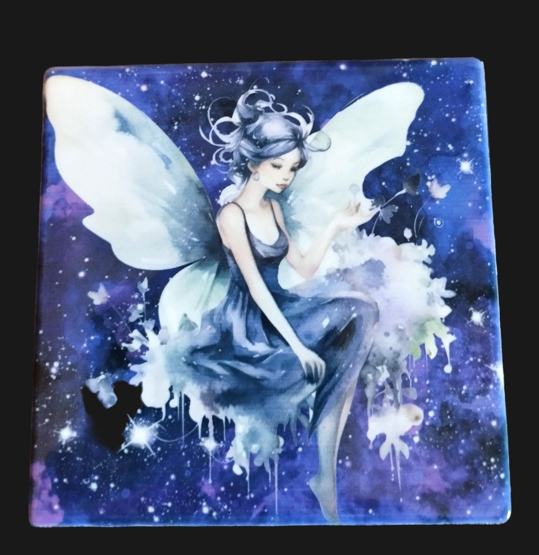Fairy coaster with a fantasy design on a blue background