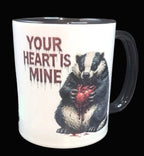 Mug with badger holding a heart and text 'Your Heart is Mine' on a dark background