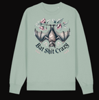 Light green long-sleeve shirt with bat design and text on a white background