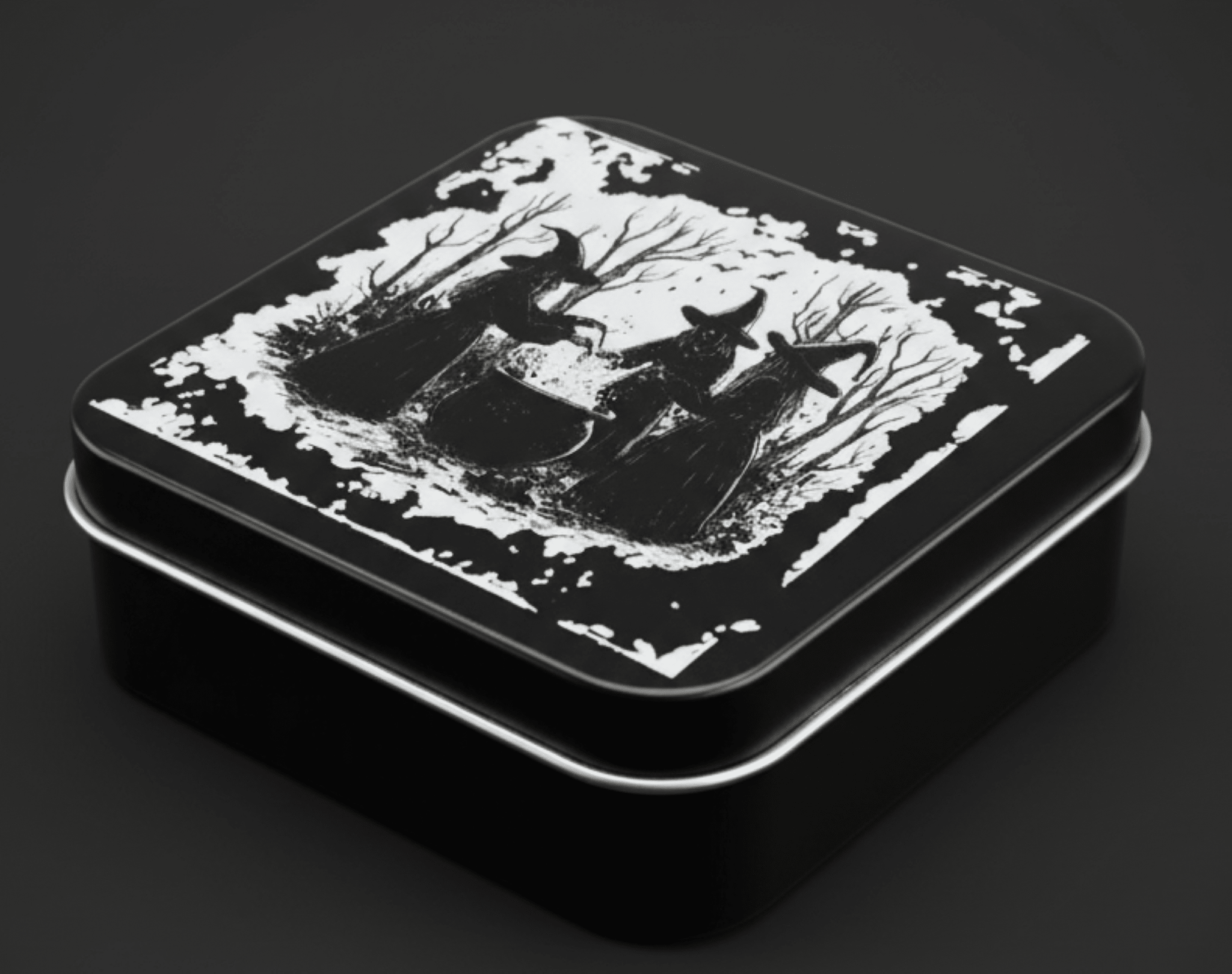 Black tin box with white silhouette design on a dark background