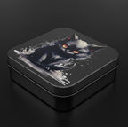 Square tin box with a black cat design on a dark background
