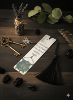 Bookmark with tassel on a wooden surface with keys, lavender, and leaves.