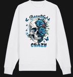 White long-sleeve shirt with a skull design featuring flowers and butterflies, with 'Beautifully Crazy' text.