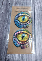 Packaged colorful eye design coasters on a wooden surface