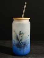 Tumbler with fairy design, wooden lid, and metal straw on a dark background