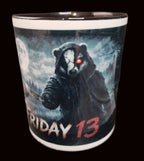 Mug with a bear in a hood and red eye design, labeled 'Friday 13'.