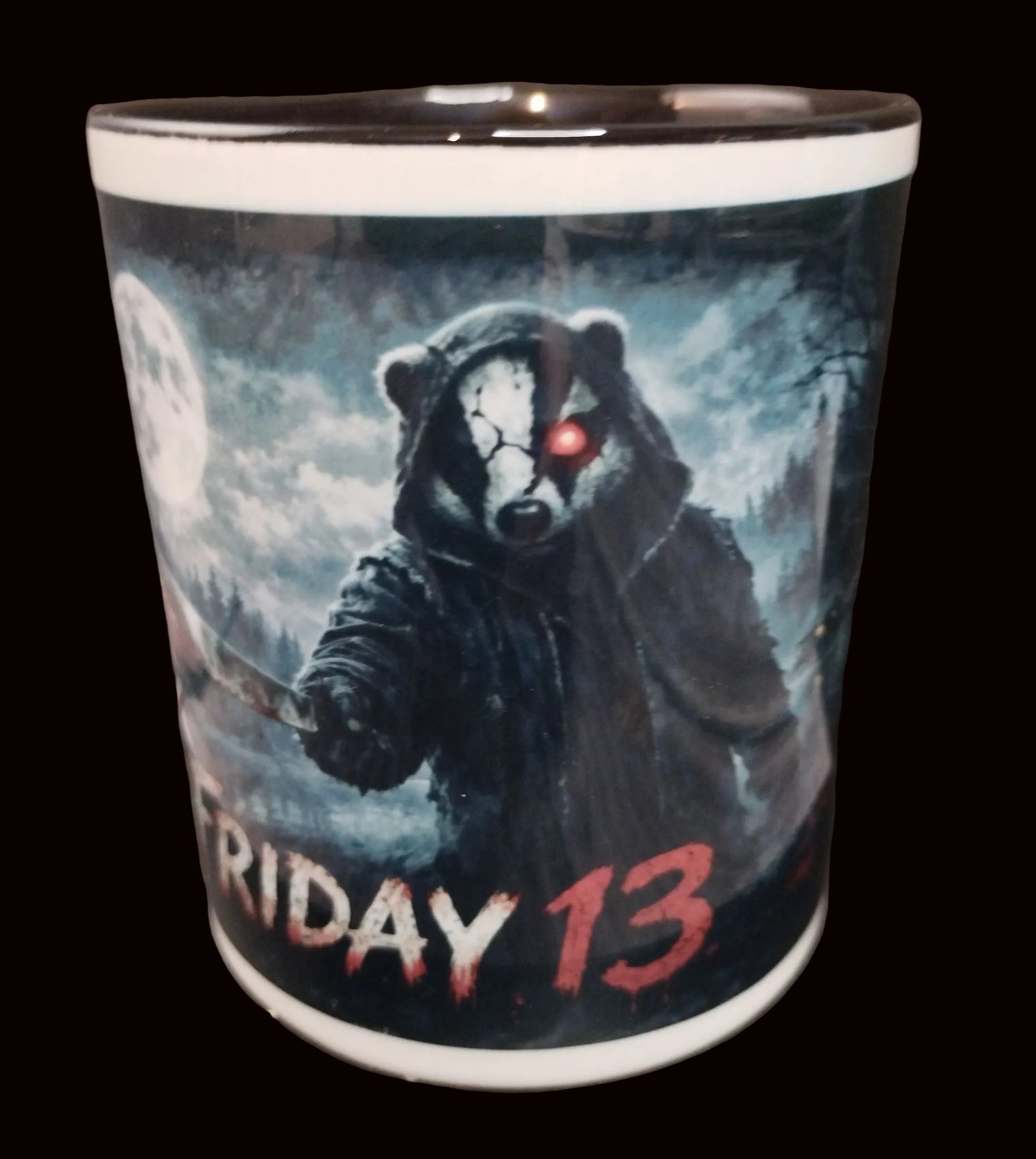 Mug with a bear in a hood and red eye design, labeled 'Friday 13'.