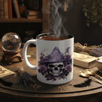 White mug with skull and witch hat design on a wooden table with steam rising from it.