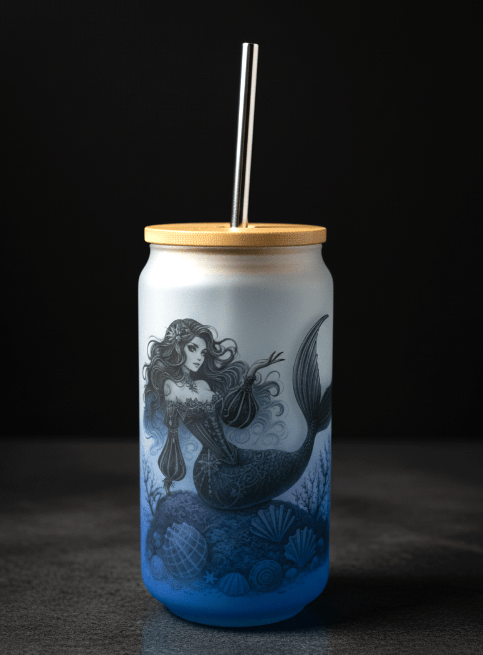 Tumbler with mermaid design on a dark background