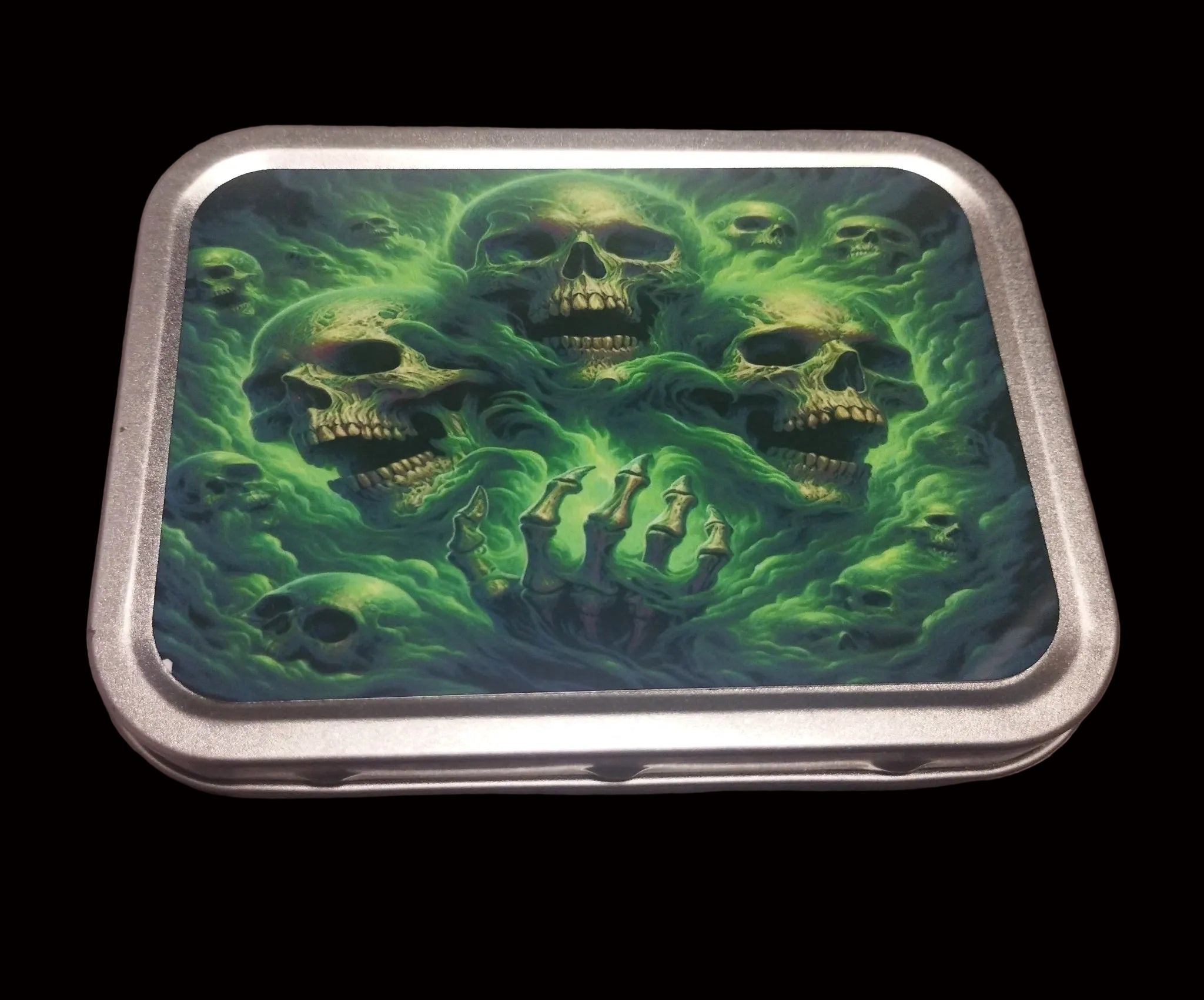 Green skulls tobacco tin with swirling green smoke and skull design on the lid